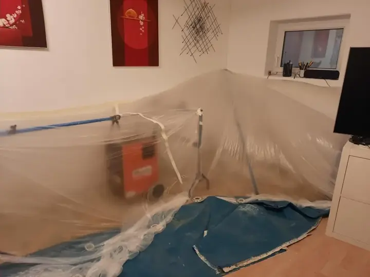 Plastic containment sealed around drying equipment in a Redding room