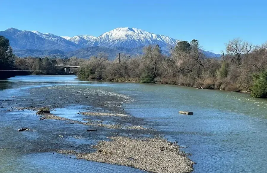 The Sacramento River near Redding with snow on the peaks beyond